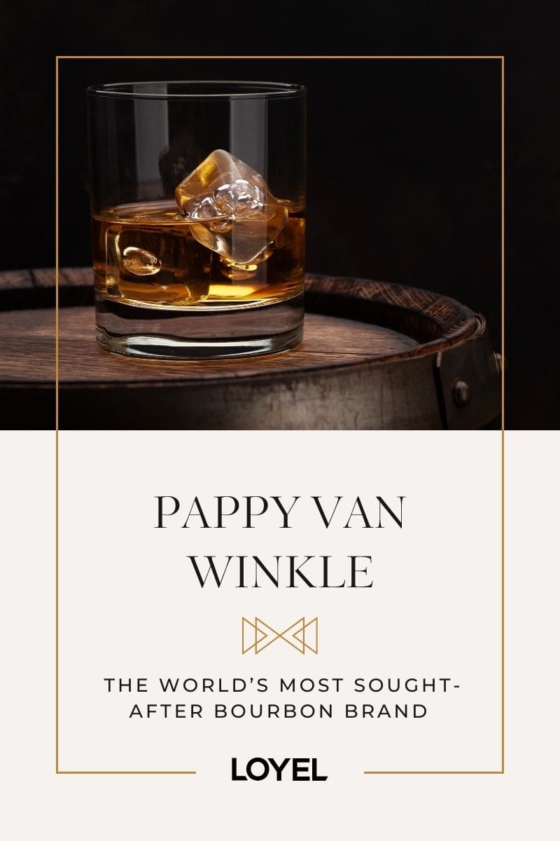 Glass of bourbon sitting on barrel